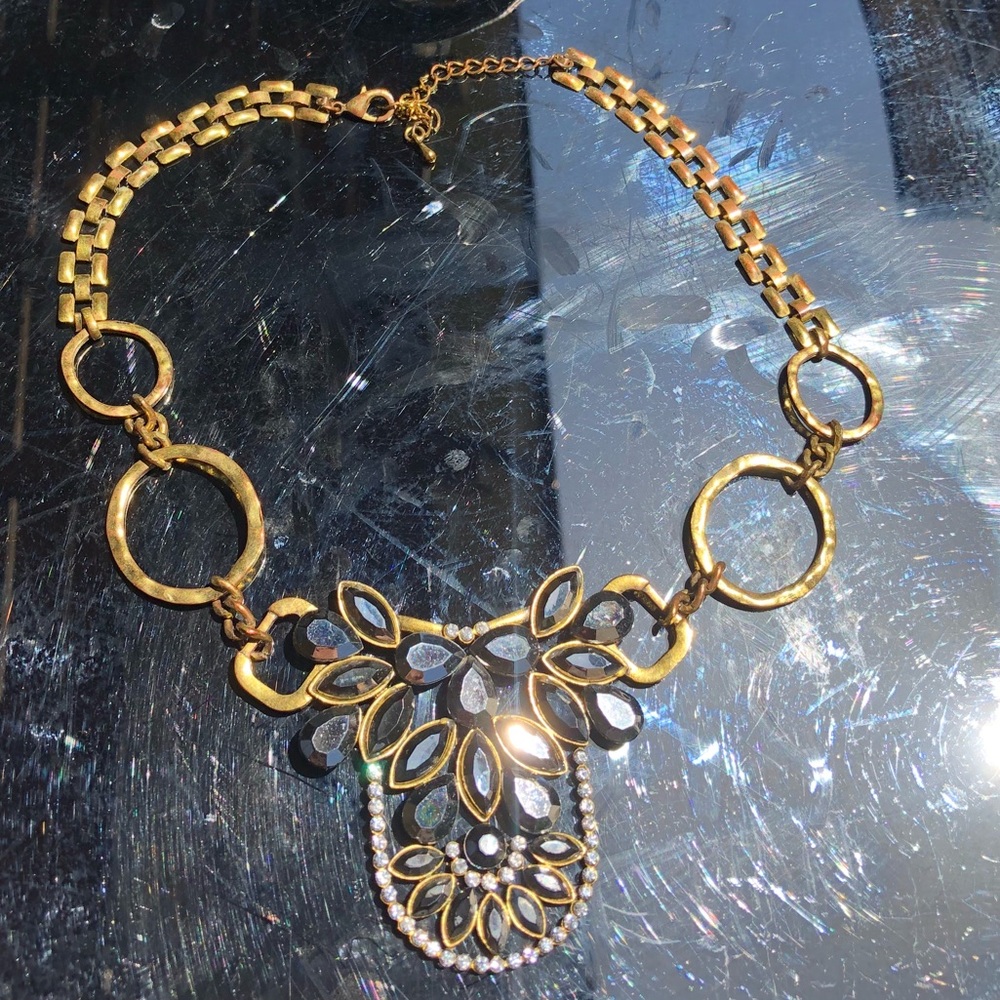 Gold, grayish-Black, and rhinestone necklace.